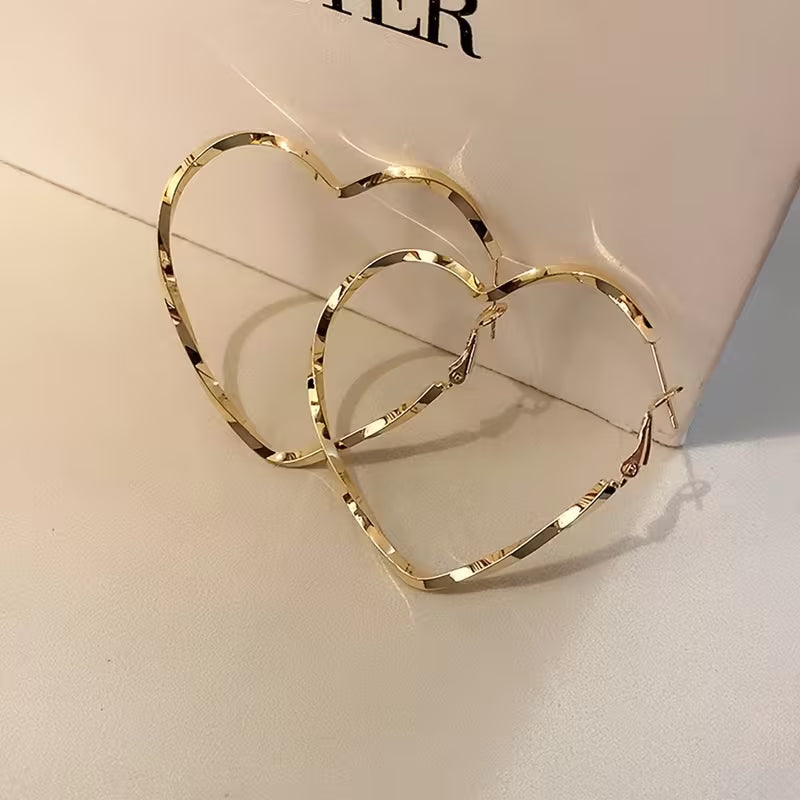 Pair of Women'S Stylish Heart-Shaped Twisted Design Hoop Earrings.