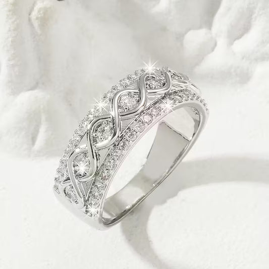Delicate Infinite Symbol Inlaid Zirconia Eternity Rings.