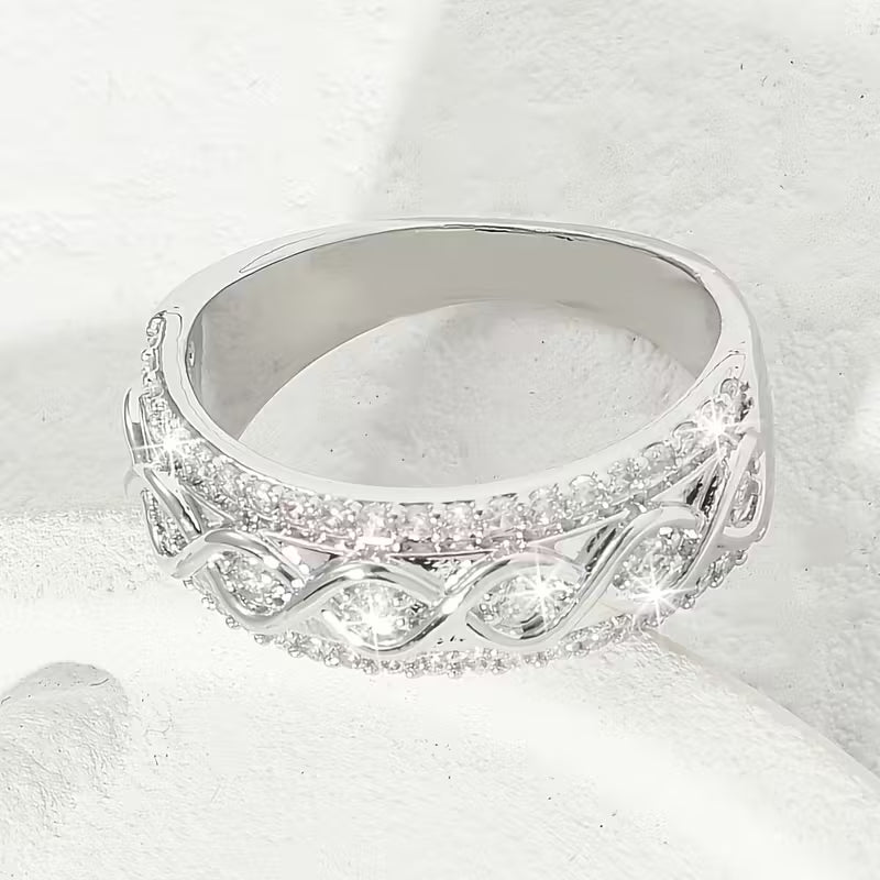 Delicate Infinite Symbol Inlaid Zirconia Eternity Rings.
