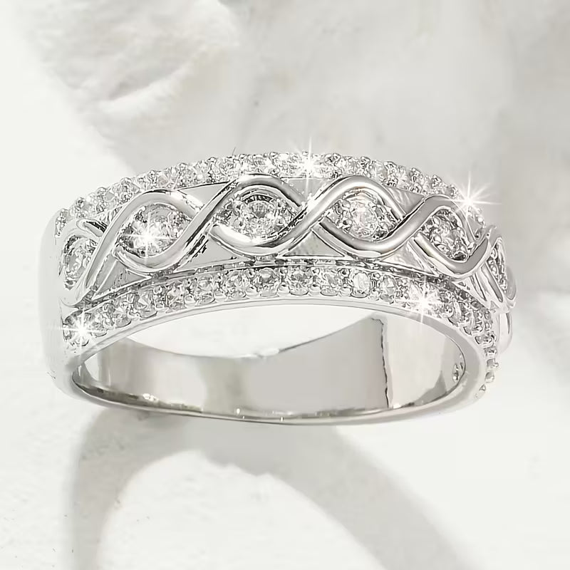 Delicate Infinite Symbol Inlaid Zirconia Eternity Rings.