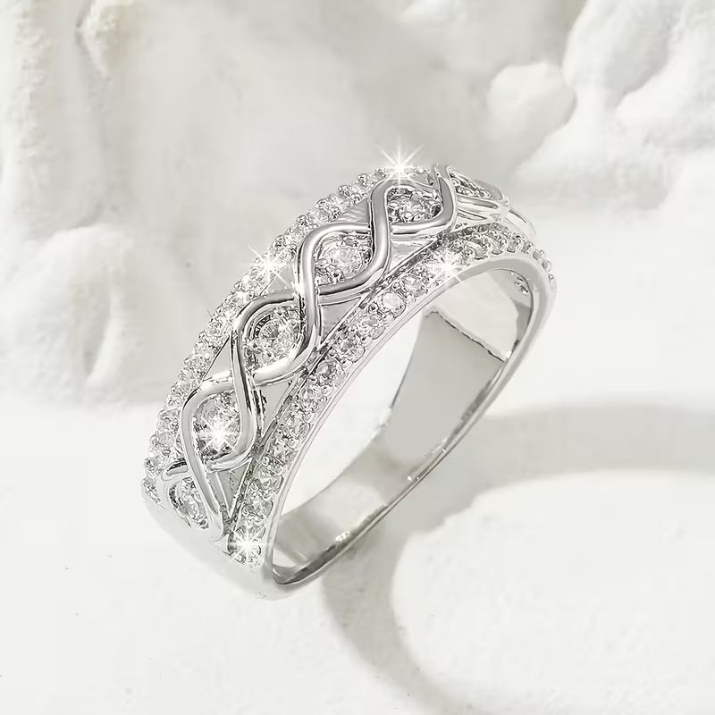 Delicate Infinite Symbol Inlaid Zirconia Eternity Rings.