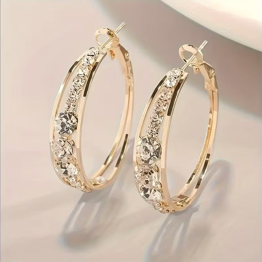 Elegant Golden Halo Hollow Round Zirconia Earrings.