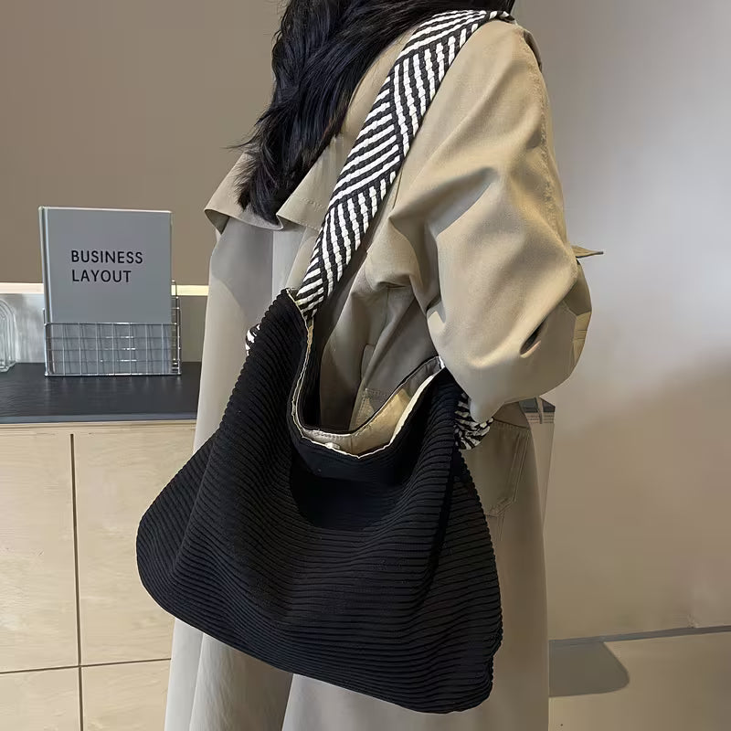 Elegant Soft Shoulder Bag with Wide Comfort Strap.