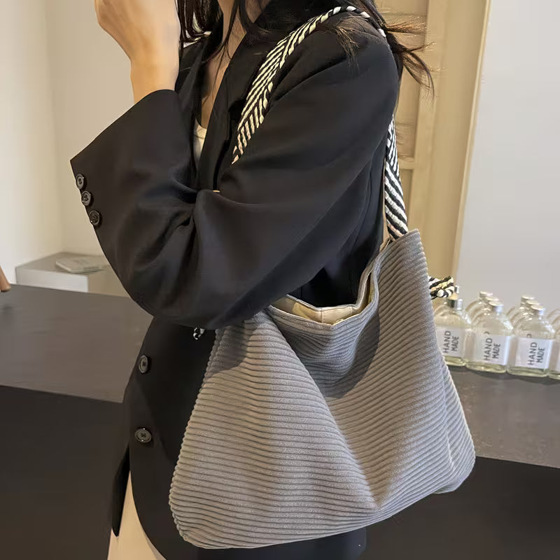 Elegant Soft Shoulder Bag with Wide Comfort Strap.