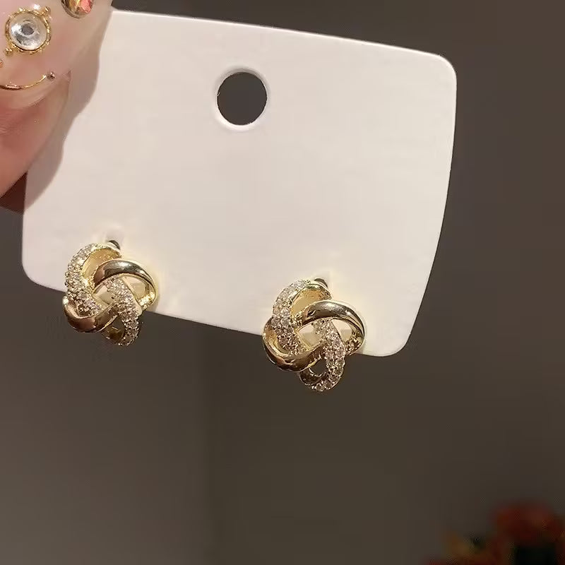 Hollow Stud Earrings with Shiny Inlaid K Plating.