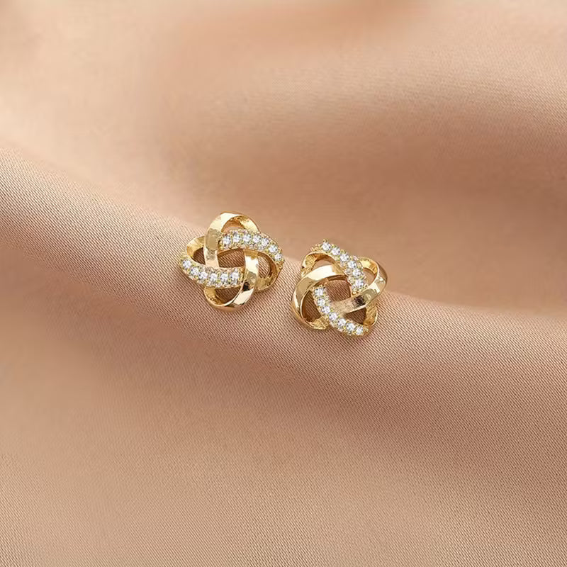 Hollow Stud Earrings with Shiny Inlaid K Plating.