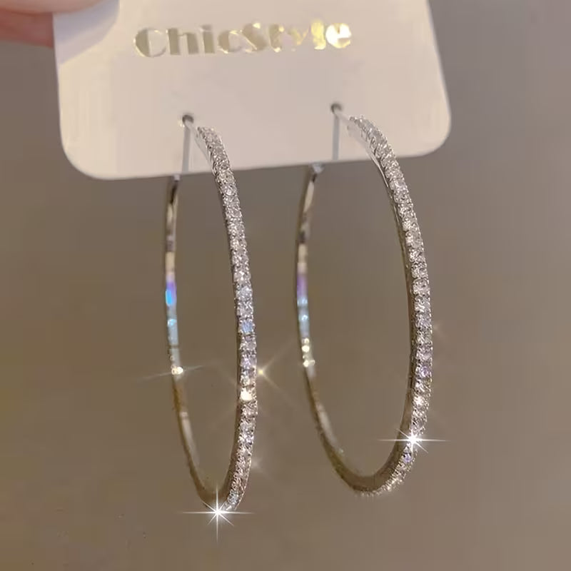 Large Rhinestone-Encrusted Statement Hoops.